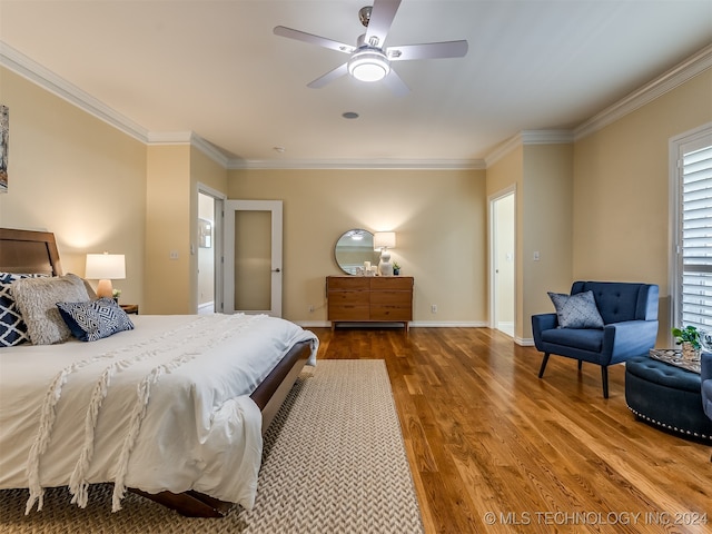 bedroom featuring crown molding, hardwood / wood-style floors, and ceiling fan