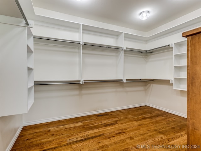 spacious closet featuring hardwood / wood-style flooring