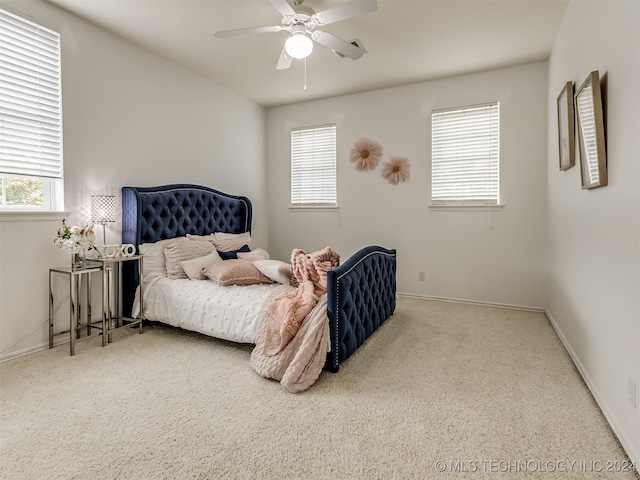 bedroom with ceiling fan and carpet flooring