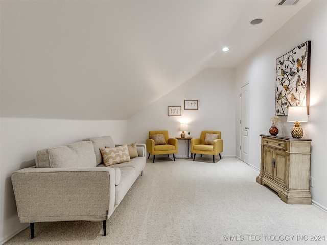 living room with vaulted ceiling and carpet