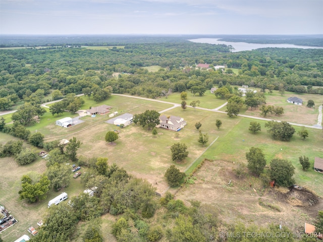 drone / aerial view featuring a water view and a rural view