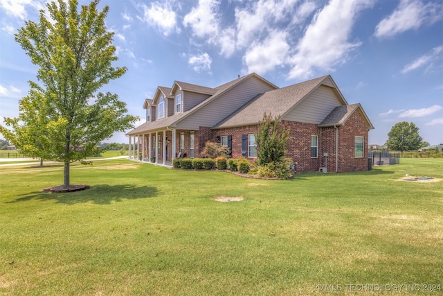 view of side of property with a yard