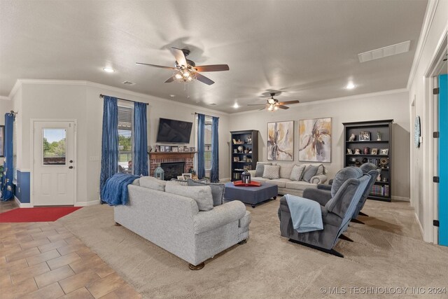 tiled living room featuring ceiling fan, crown molding, and a brick fireplace