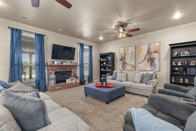 carpeted living room featuring a fireplace, ceiling fan, and ornamental molding