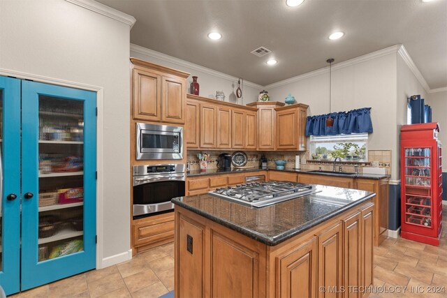 kitchen featuring tasteful backsplash, light tile patterned floors, a center island, and stainless steel appliances