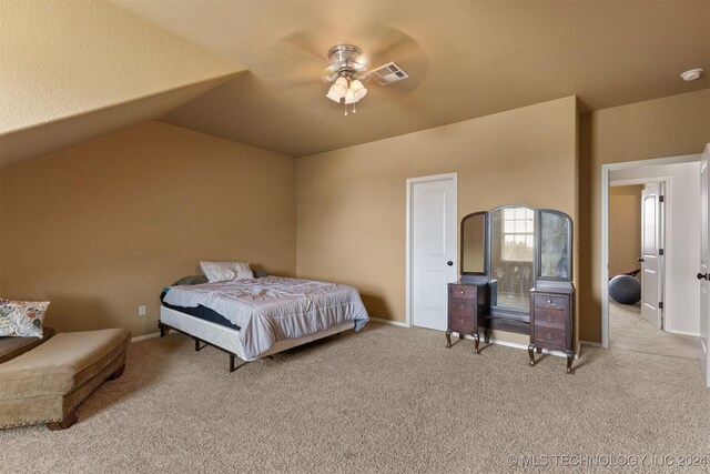 carpeted bedroom with ceiling fan and lofted ceiling