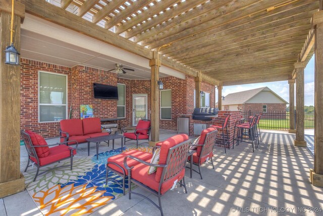 view of patio / terrace featuring a pergola, ceiling fan, and an outdoor hangout area