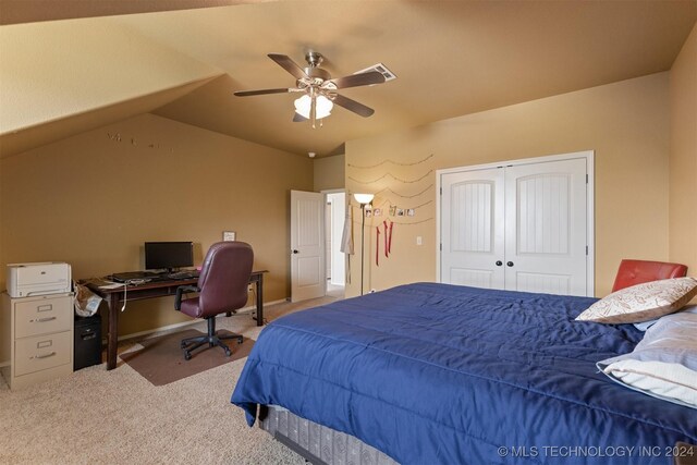 carpeted bedroom featuring a closet, ceiling fan, and lofted ceiling