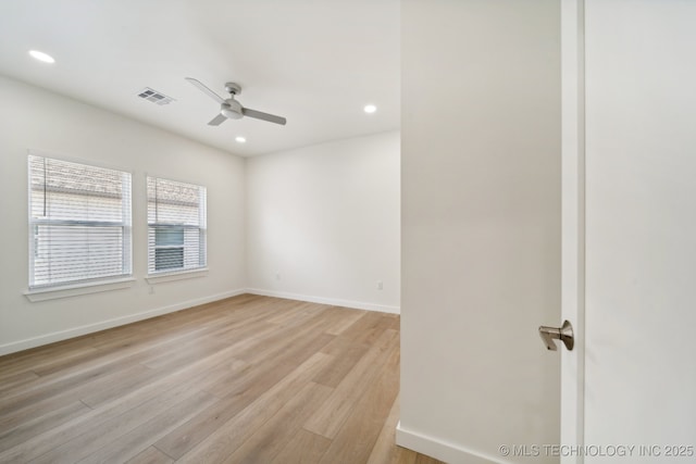 unfurnished room featuring ceiling fan and light hardwood / wood-style flooring