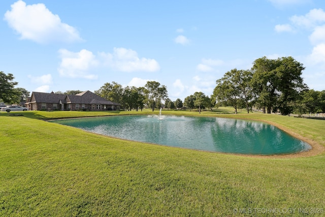 exterior space with a yard and a water view