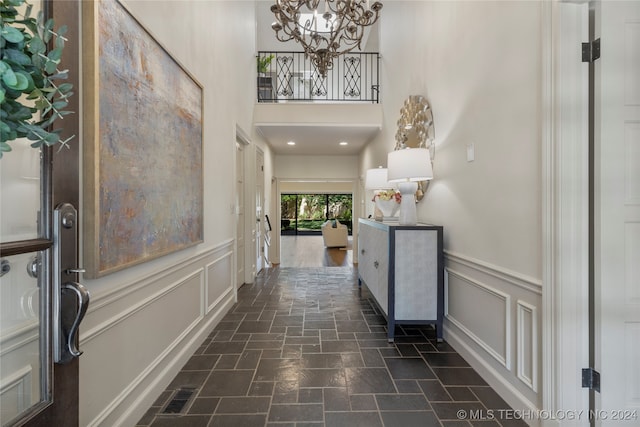 interior space featuring dark hardwood / wood-style floors and a notable chandelier