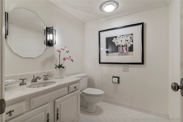 bathroom with tile patterned flooring, crown molding, toilet, and vanity