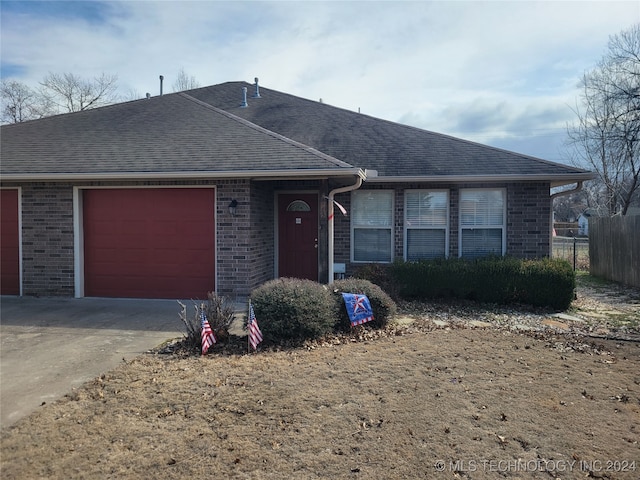 ranch-style house featuring a garage