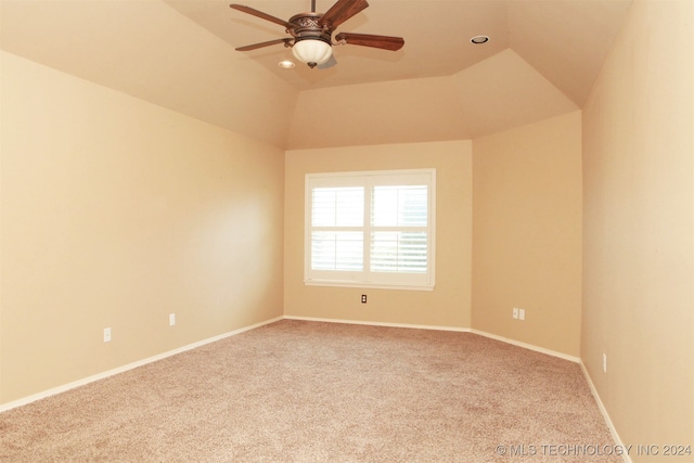 unfurnished room with ceiling fan, vaulted ceiling, and light carpet