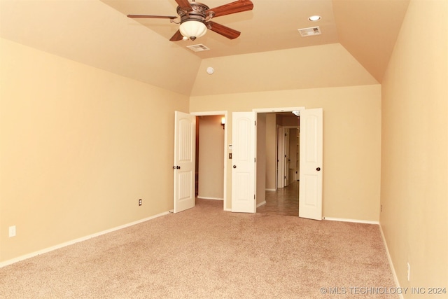 unfurnished bedroom with high vaulted ceiling, ceiling fan, and light carpet