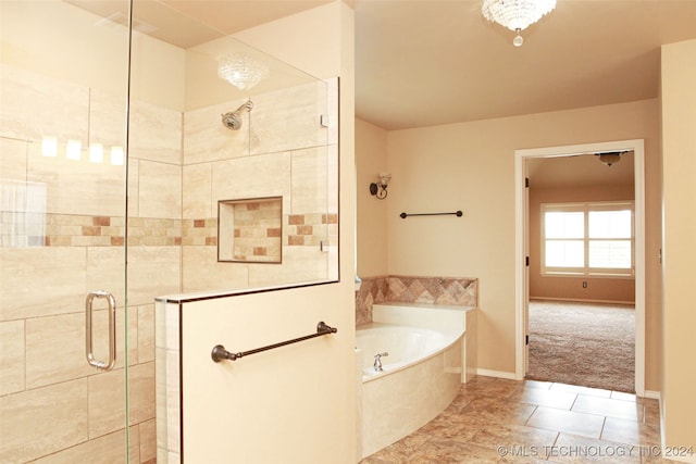 bathroom with shower with separate bathtub and tile patterned floors