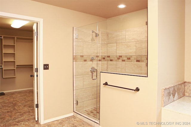 bathroom featuring tile patterned floors and walk in shower