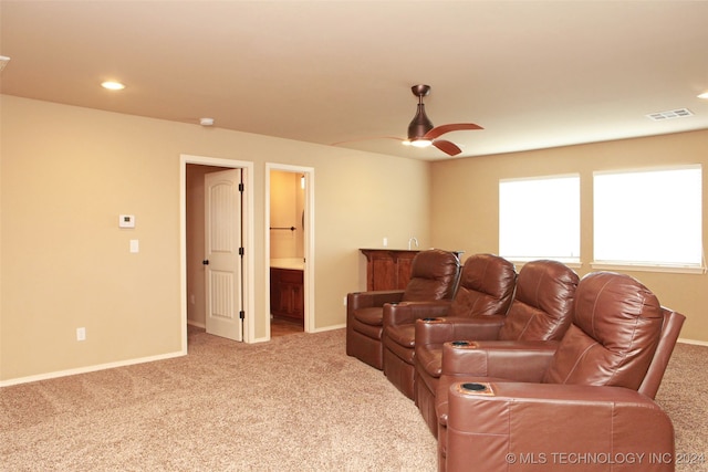 carpeted living room featuring ceiling fan