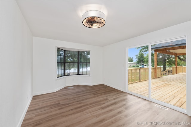 empty room with wood-type flooring