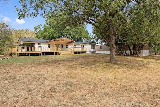 view of yard with a wooden deck