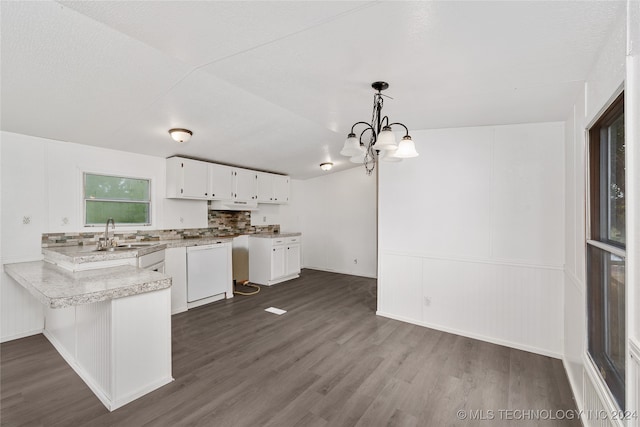 kitchen with hanging light fixtures, white cabinetry, white dishwasher, sink, and dark hardwood / wood-style floors