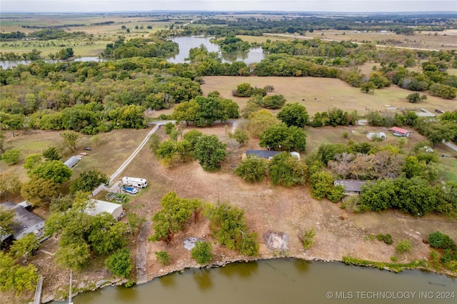 birds eye view of property featuring a water view and a rural view