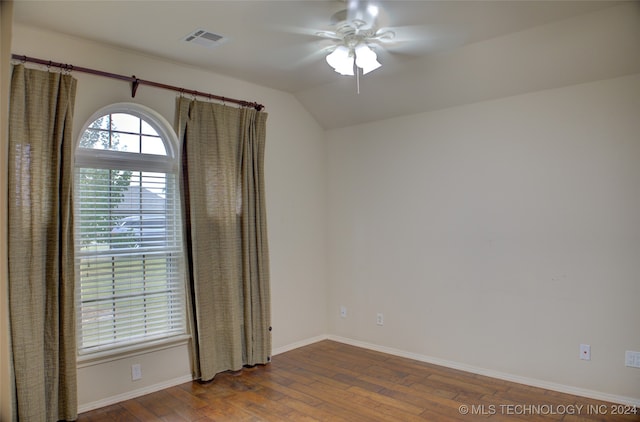 spare room featuring lofted ceiling, ceiling fan, and hardwood / wood-style flooring