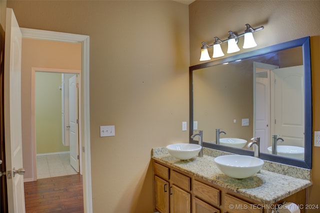 bathroom with vanity and hardwood / wood-style floors