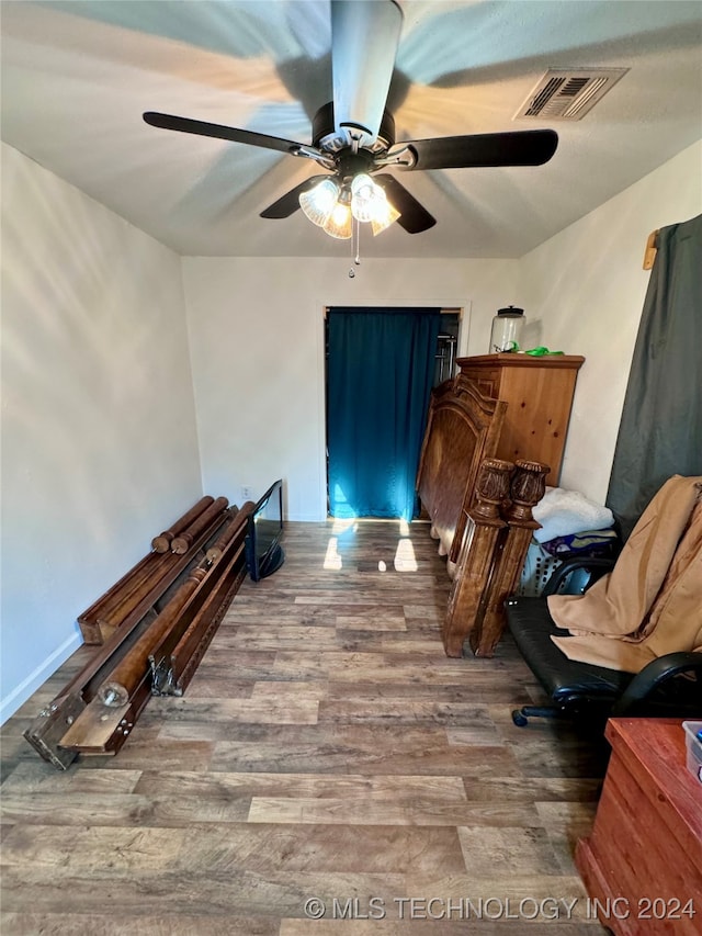 bedroom featuring ceiling fan and hardwood / wood-style floors