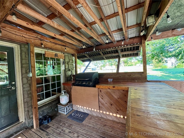 wooden terrace featuring area for grilling