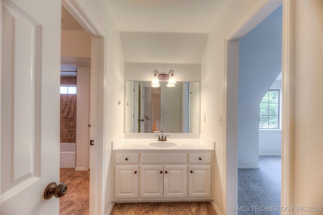 bathroom featuring tile patterned flooring and vanity