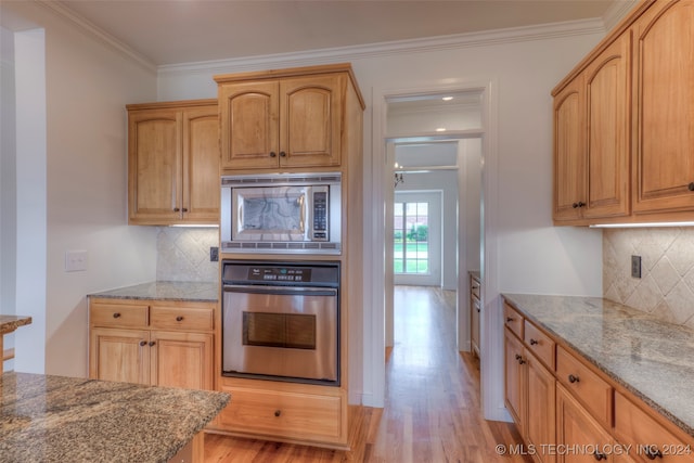 kitchen featuring stainless steel appliances, light hardwood / wood-style floors, ornamental molding, and tasteful backsplash