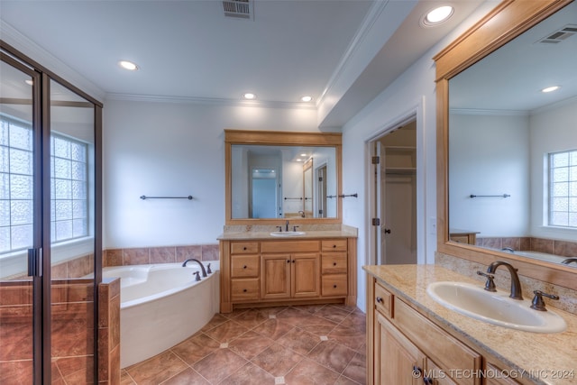 bathroom with a bathing tub, crown molding, tile patterned flooring, and vanity