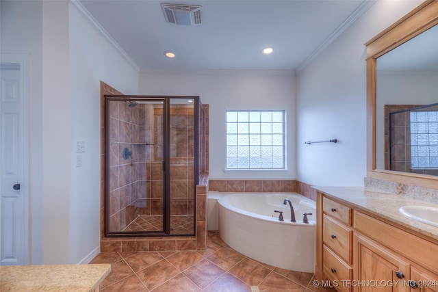 bathroom featuring plus walk in shower, tile patterned floors, ornamental molding, and vanity