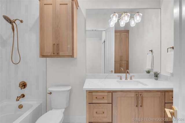 full bathroom featuring vanity, tiled shower / bath combo, and toilet