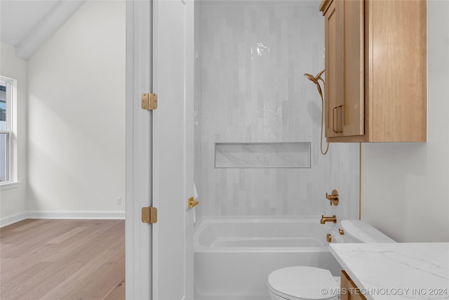 full bathroom featuring wood-type flooring, shower / washtub combination, vanity, and toilet