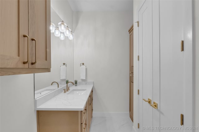 bathroom featuring tile patterned flooring and vanity