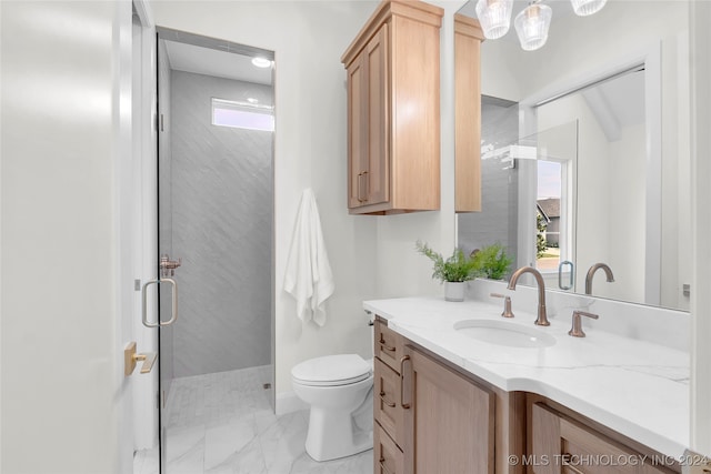 bathroom with tile patterned floors, a tile shower, vanity, and toilet