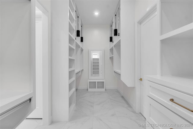 spacious closet featuring light tile patterned floors