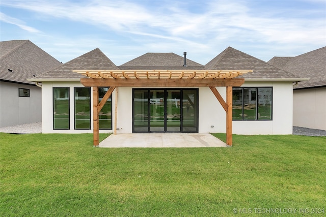 rear view of house with a patio, a yard, and a pergola