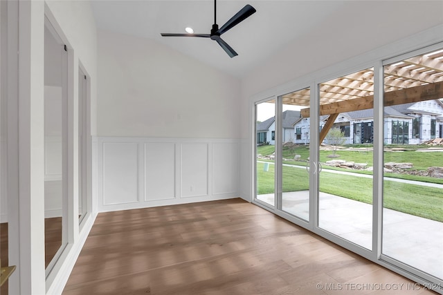 unfurnished sunroom featuring ceiling fan and lofted ceiling