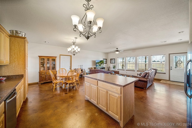 kitchen with dark countertops, concrete floors, open floor plan, and stainless steel dishwasher