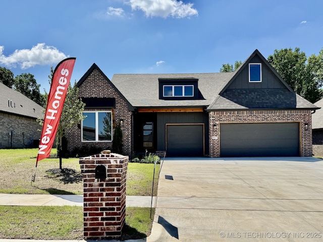807 E Jacksonville St, Broken Arrow, OK 74012 - view of front facade featuring board and batten siding, driveway, brick siding, a garage, and a shingled roof