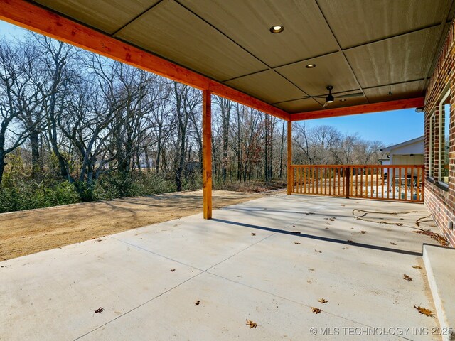 view of patio featuring ceiling fan