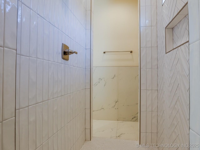 full bath featuring tiled shower