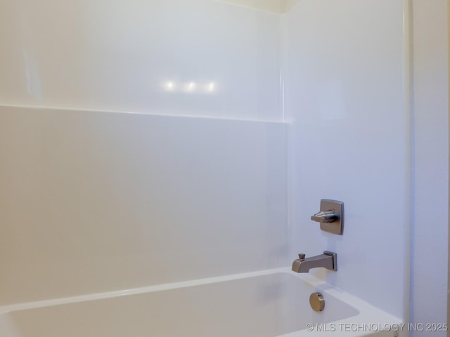 bathroom featuring  shower combination