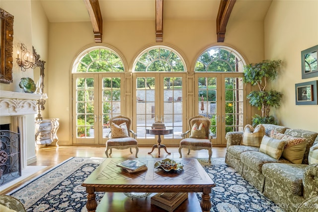 sunroom / solarium with beam ceiling and french doors