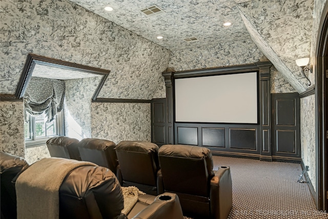 carpeted cinema with vaulted ceiling