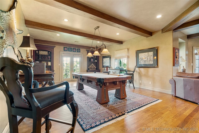 game room with billiards, beamed ceiling, french doors, and light hardwood / wood-style floors