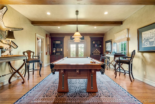 playroom featuring light wood-type flooring, a wealth of natural light, pool table, and beamed ceiling